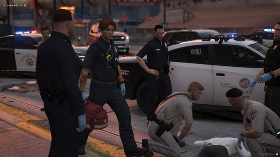 Arrival of paramedics to provide medical assistance to the victim from the burning car