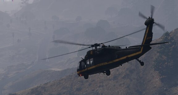 Border Patrol UH60 on mountains
