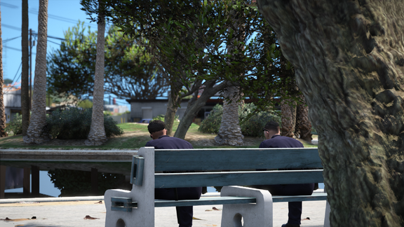 Two lives paused beneath the indifferent sunlight.